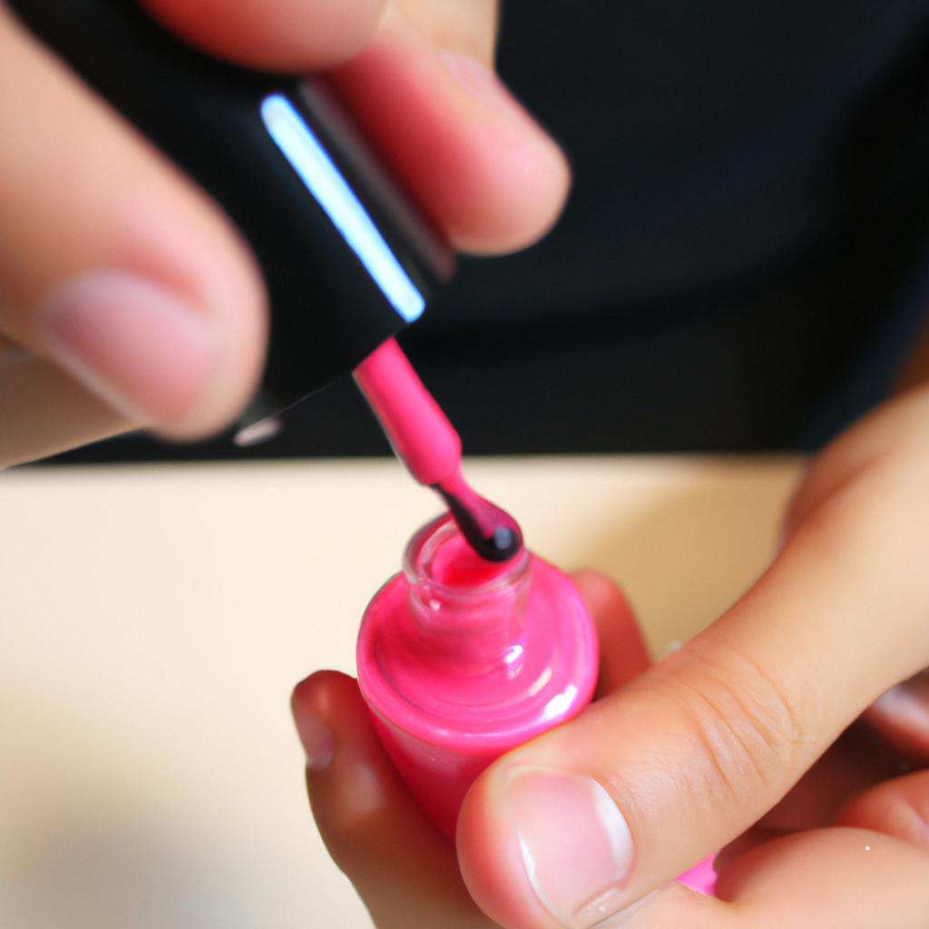 Person applying nail polish carefully